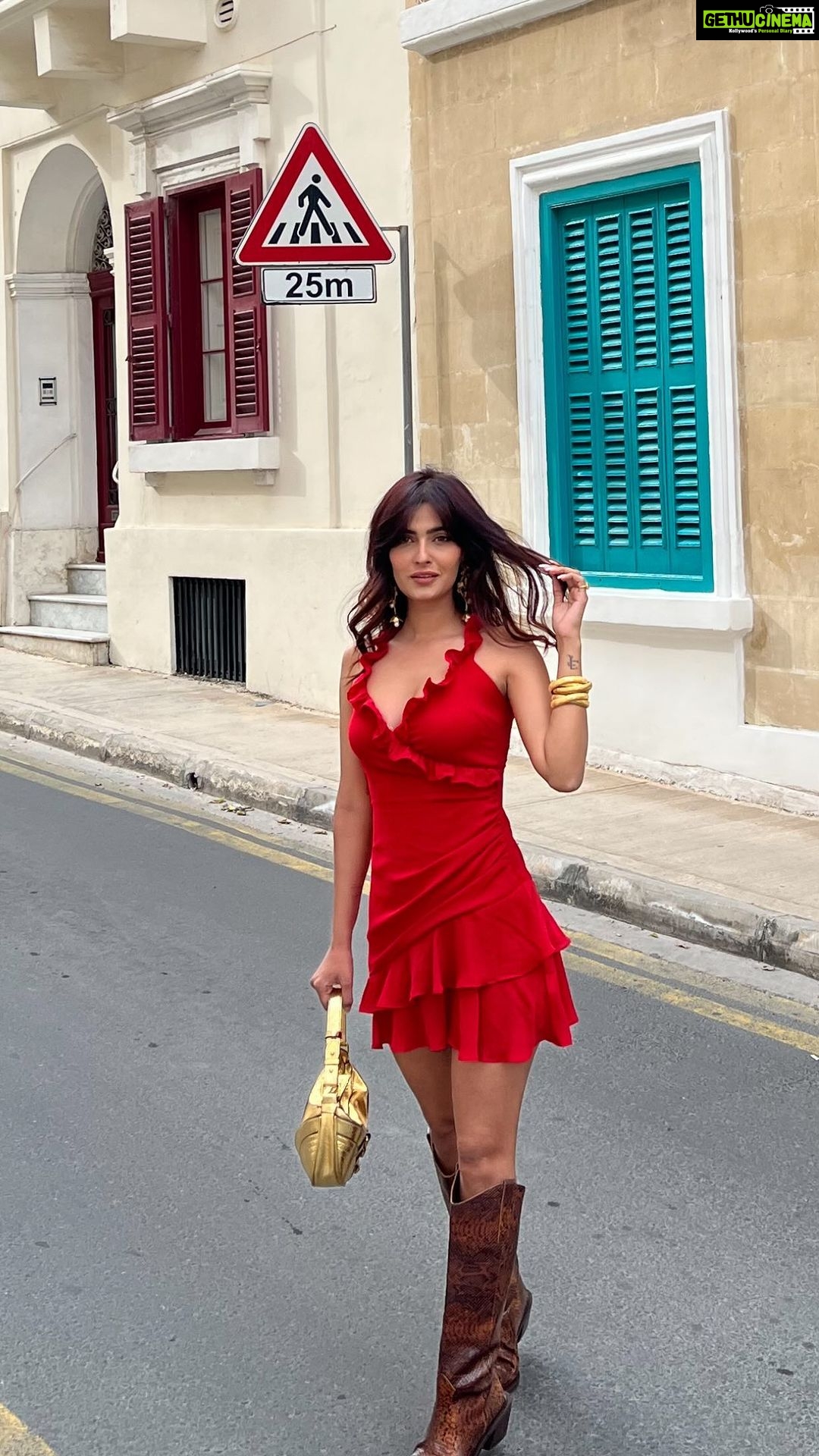 Karishma Sharma Instagram - Traveling and exploring new places can be a great way to broaden your horizons, learn about different cultures, and gain new experiences. Malta is a beautiful country with a rich history and many interesting places to visit. It’s great that I enjoy walking around and exploring the colorful buildings with balconies - this is a great way to soak in the local atmosphere and appreciate the architecture. I wanna keep on traveling and exploring, and may my soul continue to be filled with happiness and joy! Boots @alohas Jewelleery by @bloome.in