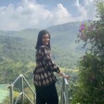 Leona Lishoy Instagram - My happy place @thekissingmountains in Vagamon. I never tire of the view from this property. I could spend hours watching the hill chain and breathing the fresh air! The burbling streams, rustling pine trees and chirping birds, all in perfect harmony. . . Video @pavel_dinesh #nature #howhillsmakemehappy #reels #reelitfeelit #instagood