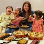 Mahhi Vij Instagram - My heart overflowed with pure joy of motherhood long before I held my biological child. It all began when Khushi and Rajveer opened their arms and welcomed me into their lives, four whole years, before Tara happened. I feel so lucky when I see them cuddled up in bed to hear bedtime stories, listen to Rajveer's cues while shooting a reel, watching Tara apply make-up on Khushi and always taking each others side. 😍 This Mother's Day, we celebrated our love by sharing (and fighting over) a shaandaar daawat from @behrouzbiryani. Looking at them savouring the flavours of royal biryanis, kebabs and Tara’s favourite “gulaabjamoooon”, it filled my heart like never before. Aur kisi ne bilkul sahi kaha hai, "A family that eats together, stays together!" 👑 Happy Mother's Day, moms! ✨ #behrouzbiryani #behrouz #mothersday #celebration #biryani #love