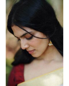 Malavika Mohanan Instagram - Happy Vishu everyone ✨♥️

It’s that one day in the year where I get to wear a traditional ‘kasavu’ saree without it feeling out of context, and maybe because I hardly get to do it is why I sway in the direction of always donning a classic one and nothing too sartorially adventurous. I wear it with jewelry strictly borrowed from mom’s closet because she has the most beautiful gold jhumkis & traditional temple jewelry, and ours seems to be the generation that has a general disdain for accumulation of gold jewelry(or is it just me?) Anyway, I digress. So coming back to Vishu and all things malayali, here are some pictures of me in a lovely palace estate in Kerala with the most beautiful corridors & the most stunning old trees which feeds right into my nostalgia trip of my malayali roots & strangely makes me feel at home even though it’s the first time I’ve visited this place. 
Ok. Time for some payasam now. So talk to you’ll soon and hope you had your fill of ‘sadhya’ today too ☺️♥️

P.S photos by the amazing @sbk_shuhaib & everything everywhere in life is pretty much courtesy @theitembomb