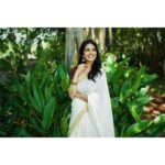 Malavika Mohanan Instagram - Happy Vishu everyone ✨♥️ It’s that one day in the year where I get to wear a traditional ‘kasavu’ saree without it feeling out of context, and maybe because I hardly get to do it is why I sway in the direction of always donning a classic one and nothing too sartorially adventurous. I wear it with jewelry strictly borrowed from mom’s closet because she has the most beautiful gold jhumkis & traditional temple jewelry, and ours seems to be the generation that has a general disdain for accumulation of gold jewelry(or is it just me?) Anyway, I digress. So coming back to Vishu and all things malayali, here are some pictures of me in a lovely palace estate in Kerala with the most beautiful corridors & the most stunning old trees which feeds right into my nostalgia trip of my malayali roots & strangely makes me feel at home even though it’s the first time I’ve visited this place. Ok. Time for some payasam now. So talk to you’ll soon and hope you had your fill of ‘sadhya’ today too ☺️♥️ P.S photos by the amazing @sbk_shuhaib & everything everywhere in life is pretty much courtesy @theitembomb