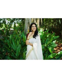 Malavika Mohanan Instagram - Happy Vishu everyone ✨♥️ It’s that one day in the year where I get to wear a traditional ‘kasavu’ saree without it feeling out of context, and maybe because I hardly get to do it is why I sway in the direction of always donning a classic one and nothing too sartorially adventurous. I wear it with jewelry strictly borrowed from mom’s closet because she has the most beautiful gold jhumkis & traditional temple jewelry, and ours seems to be the generation that has a general disdain for accumulation of gold jewelry(or is it just me?) Anyway, I digress. So coming back to Vishu and all things malayali, here are some pictures of me in a lovely palace estate in Kerala with the most beautiful corridors & the most stunning old trees which feeds right into my nostalgia trip of my malayali roots & strangely makes me feel at home even though it’s the first time I’ve visited this place. Ok. Time for some payasam now. So talk to you’ll soon and hope you had your fill of ‘sadhya’ today too ☺️♥️ P.S photos by the amazing @sbk_shuhaib & everything everywhere in life is pretty much courtesy @theitembomb