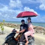 Malavika Mohanan Instagram - When you’re shooting in remote locations 🏝 so your cinematographer also doubles as your scooter driver and sometimes also as your assistant (albeit a very inefficient one) 💩 Maldives