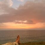 Malavika Mohanan Instagram - When I got a day off after 30 days of continuous shoot and also saw my parents after 30 days of being away from home 👨‍👩‍👧 We went to a cliffside at Varkala, had a mini picnic, saw the beautiful sea and a gorgeous sunset and came back home 🥰 (hotel is home at the moment 🤷🏻‍♀️ ) Oh, and also twinned with senior Mohanan 🐰🐰 @adityamohanan you were missed. Only a little though 💩