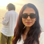 Malavika Mohanan Instagram - When I got a day off after 30 days of continuous shoot and also saw my parents after 30 days of being away from home 👨‍👩‍👧 We went to a cliffside at Varkala, had a mini picnic, saw the beautiful sea and a gorgeous sunset and came back home 🥰 (hotel is home at the moment 🤷🏻‍♀️ ) Oh, and also twinned with senior Mohanan 🐰🐰 @adityamohanan you were missed. Only a little though 💩