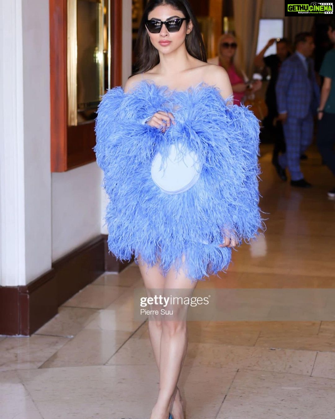 Mouni Roy Instagram - Casual in Cannes in my feather dress & a feather hat 😌 Dressed in : @jeanlouissabaji by @maisonbose Heels: @louboutinworld Eyewear: @lenskart Styled by : @thetyagiakshay Beauty : gpkritikos Creative Production- @fetch_india @pankhurifetch Photographer - @wilsonballarin Videographer - @shakeelbinafzal Lenskart - @sashakeneivonuo @anupamtripathi_ @lenskart #lenskartatcannes