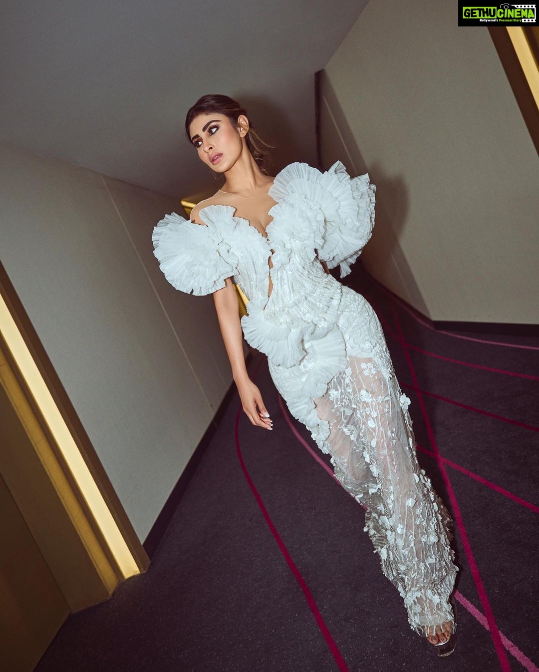 Mouni Roy Instagram - In the crucible of hardship's flame, the spirit ignites, fueled by an unwavering aim. Through the labyrinth of hustle, we navigate, chasing dreams, defying fate. And in the tapestry of life's grand design, we weave our story, where life truly shines….. Hustling err’yday 🤍 Styled by - @mohitrai with @shubhi.kumar @tarangagarwalofficial @teammrstyles Outfit - @michael5inco Shoes - @stevemaddenindia Beauty @bhavyaarora Managed by @trishilagoculdas @dcatalent 📸 @amannagoshe (happy happy birthday) 🎉 @iifa #iffa2023 Abu Dhabi, United Arab Emirates