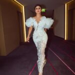 Mouni Roy Instagram - In the crucible of hardship's flame, the spirit ignites, fueled by an unwavering aim. Through the labyrinth of hustle, we navigate, chasing dreams, defying fate. And in the tapestry of life's grand design, we weave our story, where life truly shines….. Hustling err’yday 🤍 Styled by - @mohitrai with @shubhi.kumar @tarangagarwalofficial @teammrstyles Outfit - @michael5inco Shoes - @stevemaddenindia Beauty @bhavyaarora Managed by @trishilagoculdas @dcatalent 📸 @amannagoshe (happy happy birthday) 🎉 @iifa #iffa2023 Abu Dhabi, United Arab Emirates