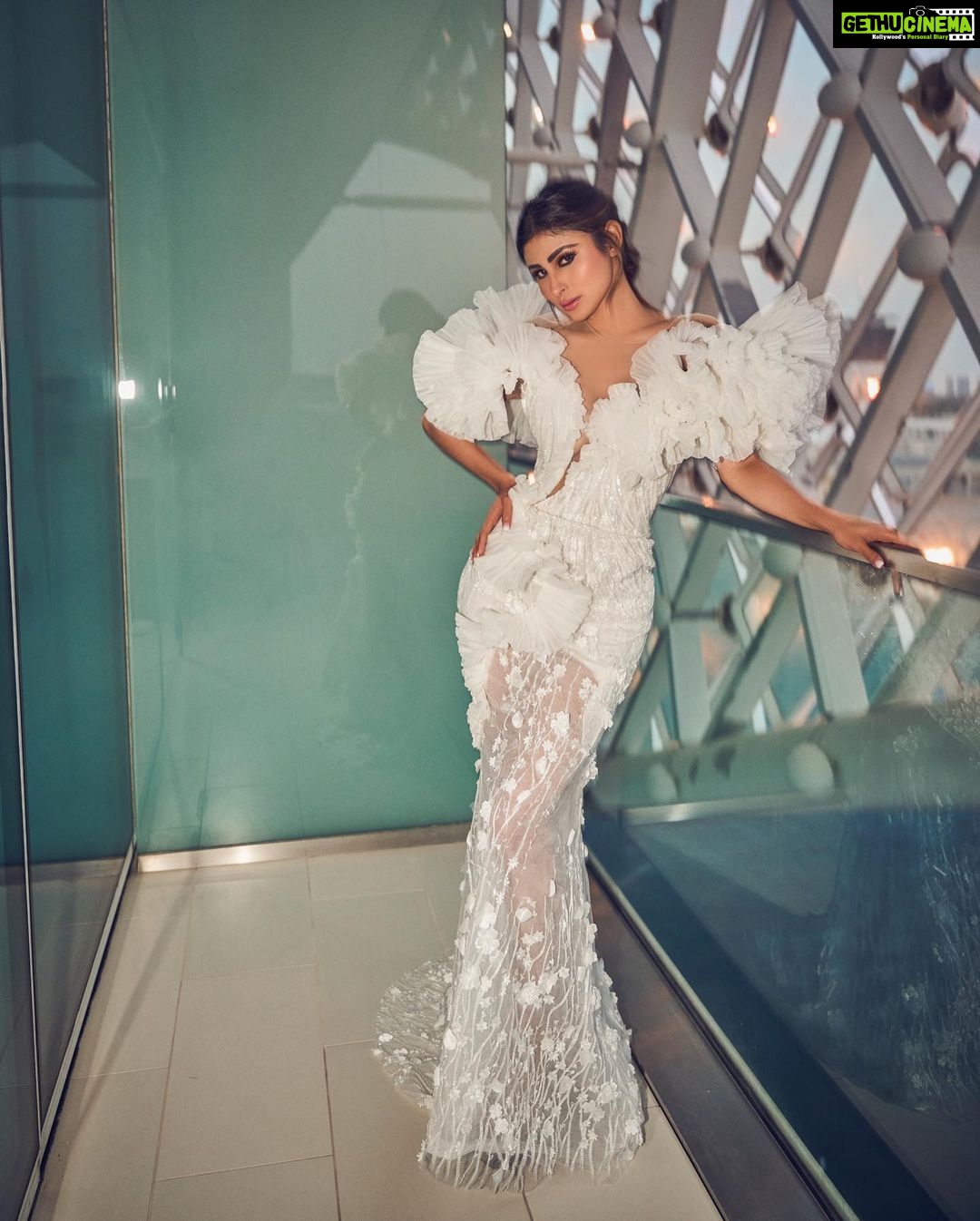 Mouni Roy Instagram - In the crucible of hardship's flame, the spirit ignites, fueled by an unwavering aim. Through the labyrinth of hustle, we navigate, chasing dreams, defying fate. And in the tapestry of life's grand design, we weave our story, where life truly shines….. Hustling err’yday 🤍 Styled by - @mohitrai with @shubhi.kumar @tarangagarwalofficial @teammrstyles Outfit - @michael5inco Shoes - @stevemaddenindia Beauty @bhavyaarora Managed by @trishilagoculdas @dcatalent 📸 @amannagoshe (happy happy birthday) 🎉 @iifa #iffa2023 Abu Dhabi, United Arab Emirates