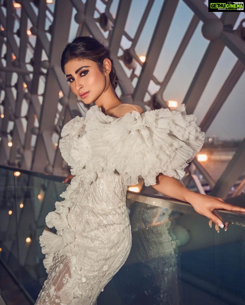 Mouni Roy Instagram - In the crucible of hardship's flame, the spirit ignites, fueled by an unwavering aim. Through the labyrinth of hustle, we navigate, chasing dreams, defying fate. And in the tapestry of life's grand design, we weave our story, where life truly shines….. Hustling err’yday 🤍 Styled by - @mohitrai with @shubhi.kumar @tarangagarwalofficial @teammrstyles Outfit - @michael5inco Shoes - @stevemaddenindia Beauty @bhavyaarora Managed by @trishilagoculdas @dcatalent 📸 @amannagoshe (happy happy birthday) 🎉 @iifa #iffa2023 Abu Dhabi, United Arab Emirates