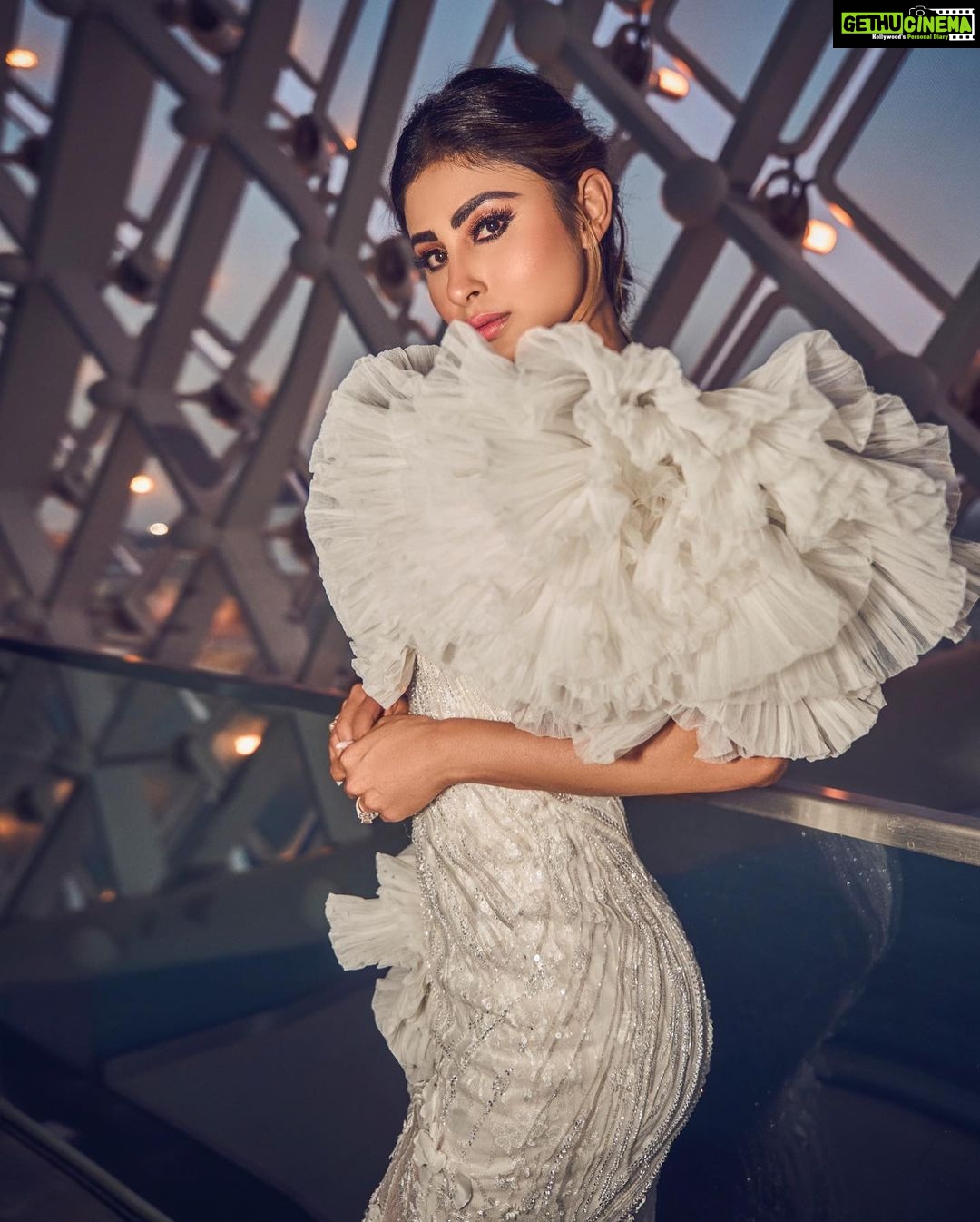 Mouni Roy Instagram - In the crucible of hardship's flame, the spirit ignites, fueled by an unwavering aim. Through the labyrinth of hustle, we navigate, chasing dreams, defying fate. And in the tapestry of life's grand design, we weave our story, where life truly shines….. Hustling err’yday 🤍 Styled by - @mohitrai with @shubhi.kumar @tarangagarwalofficial @teammrstyles Outfit - @michael5inco Shoes - @stevemaddenindia Beauty @bhavyaarora Managed by @trishilagoculdas @dcatalent 📸 @amannagoshe (happy happy birthday) 🎉 @iifa #iffa2023 Abu Dhabi, United Arab Emirates