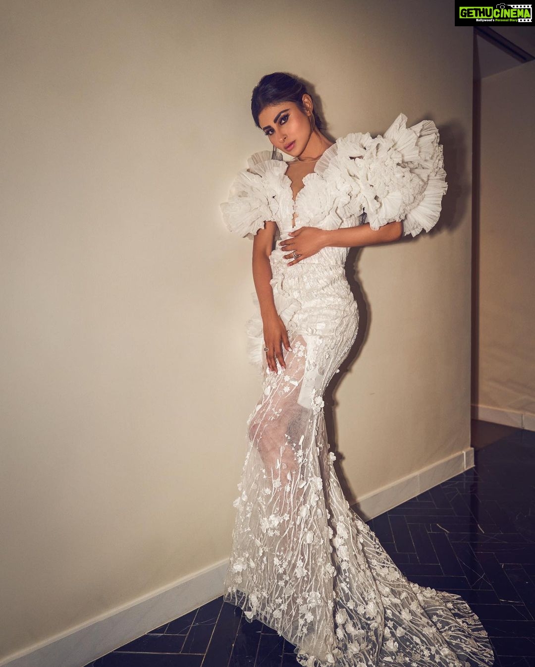 Mouni Roy Instagram - In the crucible of hardship's flame, the spirit ignites, fueled by an unwavering aim. Through the labyrinth of hustle, we navigate, chasing dreams, defying fate. And in the tapestry of life's grand design, we weave our story, where life truly shines….. Hustling err’yday 🤍 Styled by - @mohitrai with @shubhi.kumar @tarangagarwalofficial @teammrstyles Outfit - @michael5inco Shoes - @stevemaddenindia Beauty @bhavyaarora Managed by @trishilagoculdas @dcatalent 📸 @amannagoshe (happy happy birthday) 🎉 @iifa #iffa2023 Abu Dhabi, United Arab Emirates