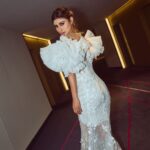 Mouni Roy Instagram - In the crucible of hardship's flame, the spirit ignites, fueled by an unwavering aim. Through the labyrinth of hustle, we navigate, chasing dreams, defying fate. And in the tapestry of life's grand design, we weave our story, where life truly shines….. Hustling err’yday 🤍 Styled by - @mohitrai with @shubhi.kumar @tarangagarwalofficial @teammrstyles Outfit - @michael5inco Shoes - @stevemaddenindia Beauty @bhavyaarora Managed by @trishilagoculdas @dcatalent 📸 @amannagoshe (happy happy birthday) 🎉 @iifa #iffa2023 Abu Dhabi, United Arab Emirates