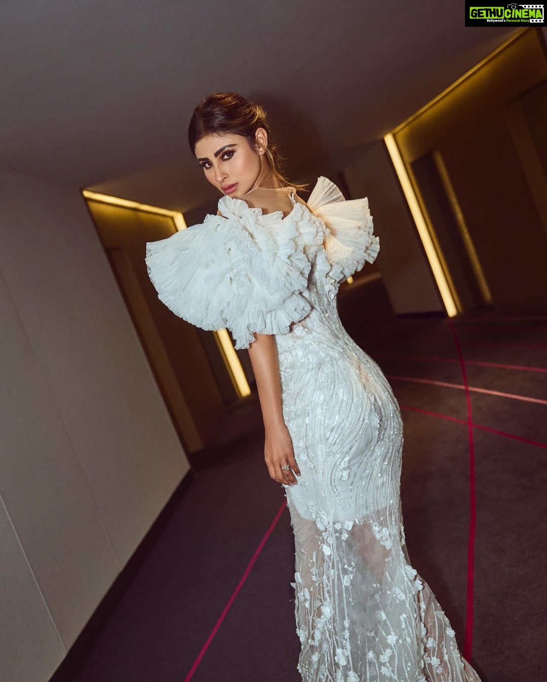 Mouni Roy Instagram - In the crucible of hardship's flame, the spirit ignites, fueled by an unwavering aim. Through the labyrinth of hustle, we navigate, chasing dreams, defying fate. And in the tapestry of life's grand design, we weave our story, where life truly shines….. Hustling err’yday 🤍 Styled by - @mohitrai with @shubhi.kumar @tarangagarwalofficial @teammrstyles Outfit - @michael5inco Shoes - @stevemaddenindia Beauty @bhavyaarora Managed by @trishilagoculdas @dcatalent 📸 @amannagoshe (happy happy birthday) 🎉 @iifa #iffa2023 Abu Dhabi, United Arab Emirates