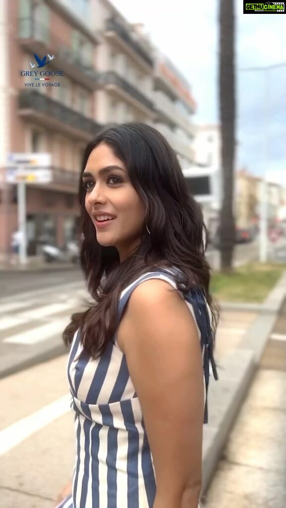Mrunal Thakur Instagram - Warning: Dancing in stripes may cause uncontrollable happiness and spontaneous twirls! 😄 HMU - @shraddhamishra8 Styling - @rahulvijay1988 assisted by @thanishqkokare Photo - @eastmancolourr Video - @amitsingh.dop @shakeelbinafzal Dress - @lovebirds.studio Earrings - @simranchhabrajewels @ascend.rohank Shoes - @lucianopadovan_official #Cannes2023 #Collab #GreyGoose #ViveLeVoyage @greygoose @fetch_india