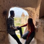 Nakshathra Nagesh Instagram – Exploring the cave life. #cappadociaturkey 

#NakshuFoundherRagha #Turkey2023 

1. The entrance to a cave 
2. Looking out the window 
3. Naturally formed volcanic formations that resemble mushrooms 
4. Climbed up the stairs to a settlements that housed about 2000 people even till the 1950s
5. A little extra love
6. A cool pose because we were too scared to climb up, the little holes you see is what people used back then to get on top of the structure 🤷🏻‍♀️ 

#happytravellers Turkey – Cappadocia
