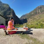 Nandini Rai Instagram - My view is perfect with a cup of tea and the mountains touching the blue sky ..! #mountains #fyp #bench #sweaterweather #tea Harshil valley - mini Switzerland