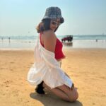 Nandita Swetha Instagram - Soaking under the sun☀️☀️☀️ . Cap @h&m Sunglares @vogueindia Crop top @tokyo_talkies Shorts @onlyindia Shirt @zara Sneaker @zara . #look #beachlook #sports #sunset