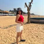 Nandita Swetha Instagram - Soaking under the sun☀️☀️☀️ . Cap @h&m Sunglares @vogueindia Crop top @tokyo_talkies Shorts @onlyindia Shirt @zara Sneaker @zara . #look #beachlook #sports #sunset