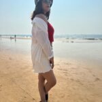 Nandita Swetha Instagram - Soaking under the sun☀️☀️☀️ . Cap @h&m Sunglares @vogueindia Crop top @tokyo_talkies Shorts @onlyindia Shirt @zara Sneaker @zara . #look #beachlook #sports #sunset