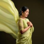 Navya Nair Instagram - "Dancing in the golden sunbeams, I'm draped in this exquisite green saree, a symphony of warmth and grace ☀️🌼 Every delicate fold, like a petal kissed by the sun, embraces my soul, weaving a radiant tale of joy and love 🌻✨ Let's bask in this luminous glow together, my beautiful Insta-fam, and spread the light that shines within us all 🌟💛 #SareeLove #EternalSummer #PoetryInMotion #Evergreen Styled @rn.rakhi MUA @makeupby_nami_ Wearing @zuleiha_by_shehazeen Jewellery @adorebypriyanka . Styling assistants @susaaani_ @sandra_resmi Photography @bigstoriesweddingcompany