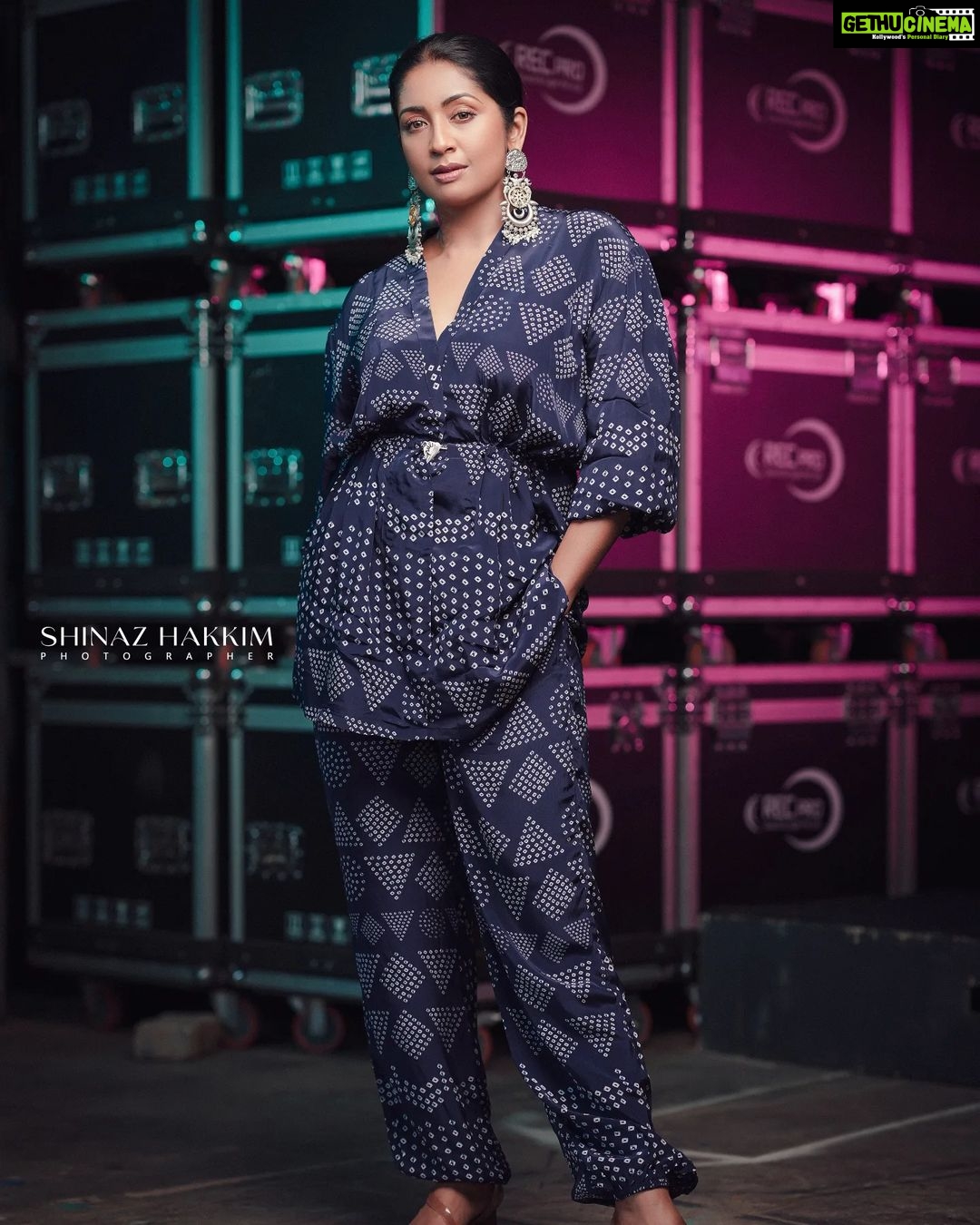 Navya Nair Instagram - "Wrapped in the magic of blue, where dreams and reality intertwine, I stand amidst the reels that hold stories untold. May hope be our constant guide, leading us to worlds yet undiscovered. ๐๐๏ธ #CinematicDreams #BlueInspiration" Styled by @rn.rakhi @amkaindia Jewellery @adorebypriyanka . MUA @makeupby_nami_ Styling assistants @susaaani_ @sandra_resmi Photography @bigstoriesweddingcompany