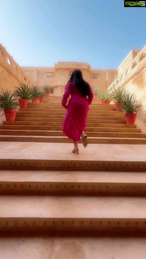 Navya Nair Instagram - In the golden heart of Jaisalmer, I tread, Where ancient whispers echo, time's tapestry spread. Each step a dance with history's grace, A palace of dreams, in this desert embrace. Sun-kissed walls, the stories they've seen, Of love and loss, of kings and queens. I wander in awe, this regal maze, A timeless beauty, my soul ablaze. Rajasthan's jewel, a realm so rare, In every corner, magic in the air. As I leave, forever changed, I see, The palace within, a reflection of me. ✨🕌💫 #JaisalmerDreams #TimelessWanderer @suryagarh Shots @amal_ajithkumar Edits @4rshuuu