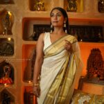 Navya Nair Instagram - "Adorned in this enchanting traditional saree with golden glowing tapestry, I find myself immersed in divine elegance ✨🌟 A sublime fusion of heritage and grace, this ethereal attire weaves a tale of celestial beauty, illuminating my very soul 💫🥰 Let's celebrate our radiant roots and light up the world together, my lovely Insta-fam 🌍💛 #SareeLove #GoldenGlow #DivineElegance #CherishingTraditions" Makeup @makeupby_nami_ Styling @sabarinathk_ Wearing @kasavukada_1985 Photography @nithin_c_nandakumar