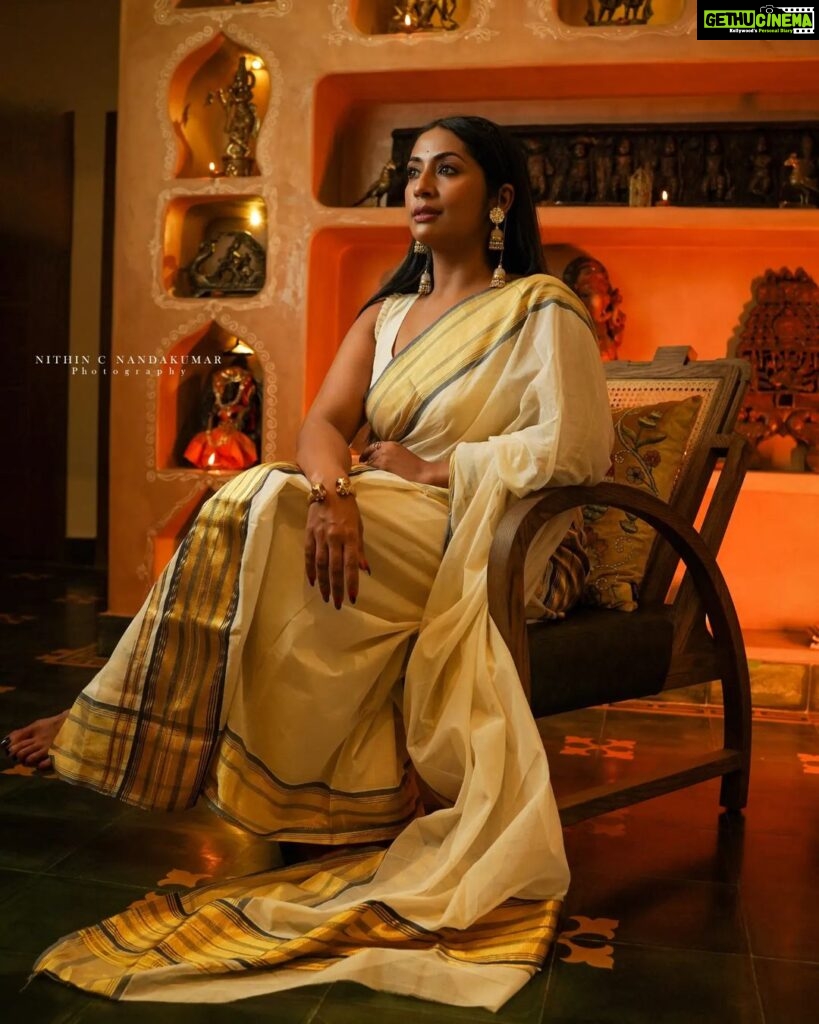 Navya Nair Instagram - "Adorned in this enchanting traditional saree with golden glowing tapestry, I find myself immersed in divine elegance ✨🌟 A sublime fusion of heritage and grace, this ethereal attire weaves a tale of celestial beauty, illuminating my very soul 💫🥰 Let's celebrate our radiant roots and light up the world together, my lovely Insta-fam 🌍💛 #SareeLove #GoldenGlow #DivineElegance #CherishingTraditions" Makeup @makeupby_nami_ Styling @sabarinathk_ Wearing @kasavukada_1985 Photography @nithin_c_nandakumar
