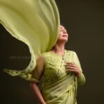 Navya Nair Instagram - "Dancing in the golden sunbeams, I'm draped in this exquisite green saree, a symphony of warmth and grace ☀️🌼 Every delicate fold, like a petal kissed by the sun, embraces my soul, weaving a radiant tale of joy and love 🌻✨ Let's bask in this luminous glow together, my beautiful Insta-fam, and spread the light that shines within us all 🌟💛 #SareeLove #EternalSummer #PoetryInMotion #Evergreen Styled @rn.rakhi MUA @makeupby_nami_ Wearing @zuleiha_by_shehazeen Jewellery @adorebypriyanka . Styling assistants @susaaani_ @sandra_resmi Photography @bigstoriesweddingcompany