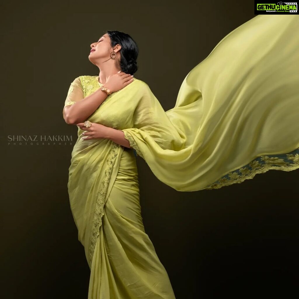 Navya Nair Instagram - "Dancing in the golden sunbeams, I'm draped in this exquisite green saree, a symphony of warmth and grace ☀️🌼 Every delicate fold, like a petal kissed by the sun, embraces my soul, weaving a radiant tale of joy and love 🌻✨ Let's bask in this luminous glow together, my beautiful Insta-fam, and spread the light that shines within us all 🌟💛 #SareeLove #EternalSummer #PoetryInMotion #Evergreen Styled @rn.rakhi MUA @makeupby_nami_ Wearing @zuleiha_by_shehazeen Jewellery @adorebypriyanka . Styling assistants @susaaani_ @sandra_resmi Photography @bigstoriesweddingcompany