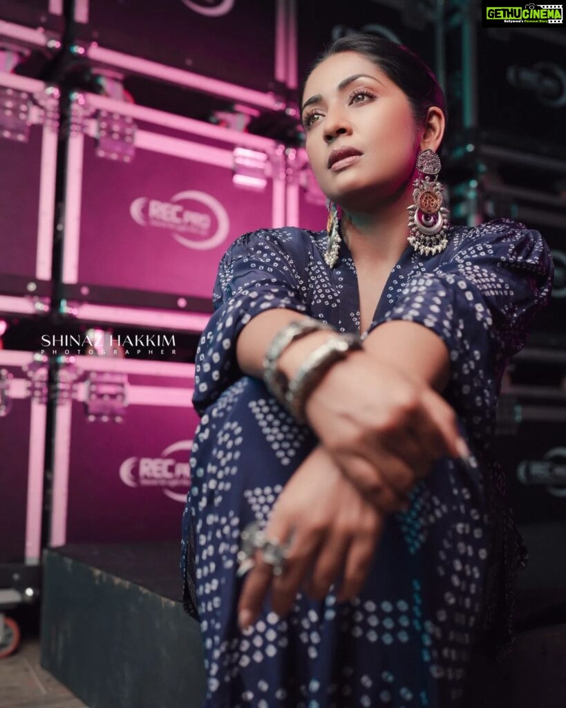 Navya Nair Instagram - "Wrapped in the magic of blue, where dreams and reality intertwine, I stand amidst the reels that hold stories untold. May hope be our constant guide, leading us to worlds yet undiscovered. 🌟🎞️ #CinematicDreams #BlueInspiration" Styled by @rn.rakhi @amkaindia Jewellery @adorebypriyanka . MUA @makeupby_nami_ Styling assistants @susaaani_ @sandra_resmi Photography @bigstoriesweddingcompany