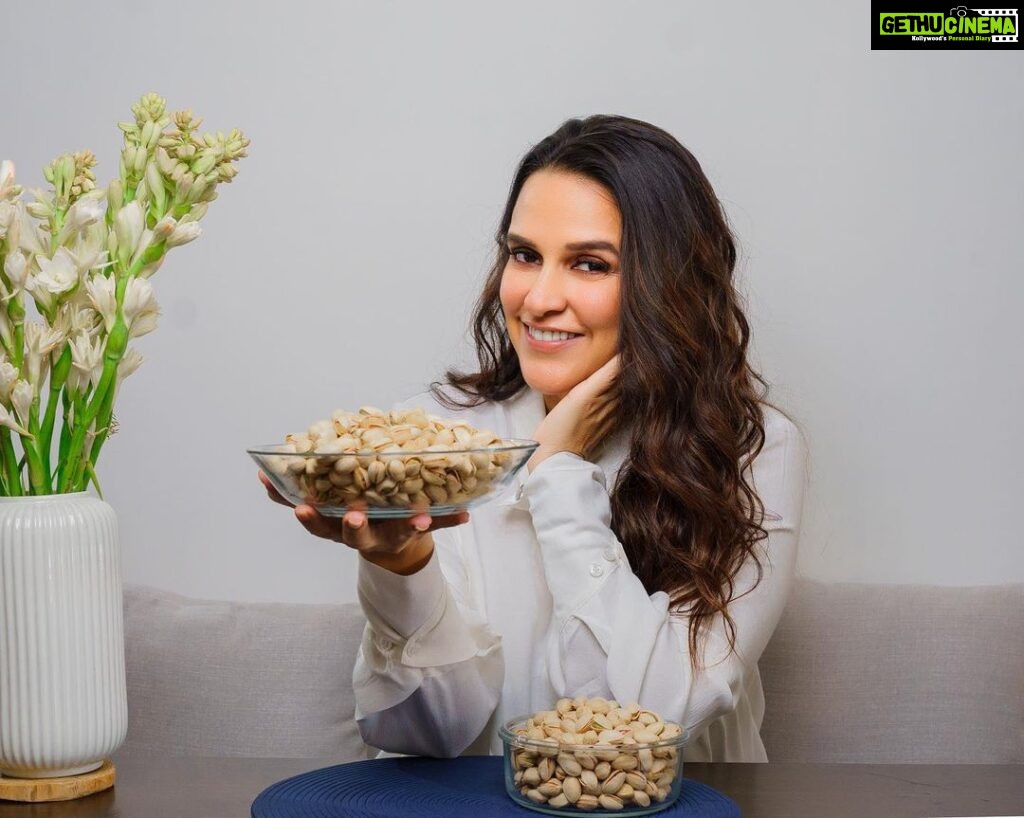 Neha Dhupia Instagram - Here is a great snack suggestion - American pistachios! @americanpistachios.india I recently came to know about a study conducted by Cornell University, that pistachios are loaded with antioxidants. In fact antioxidants in pistachios rivals the antioxidant properties of fruits like blueberries, cherries, pomegranates etc. Isn’t this amazing! In addition to being high in antioxidants pistachios are also a complete protein. They have has all the 9 essential amino acids that our body needs. Easy to store they don’t need to be cooked, just crack, pop and enjoy. American pistachios are easily available in India now. Buy them with any dry fruit retailers or any major e-commerce platform. Just search for “California pistachios” and choose from the many brands that sell them in India. #Californiapistachios #Pistachios #AmericanPistachiosIndia #AmericanPistachios