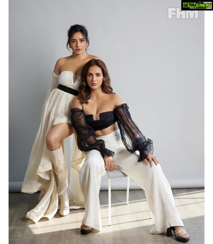 Neha Sharma Instagram - The Slaying Duo. @fhmindia Editor: @nitin.ax Fashion editor and stylist: @suchita_tish Asst. : @mehaknirh Photographer : @trishasarang Makeup: @priyankachourasia342 Hair: @tinamukharjee_official Shoot designed and managed by:@ suchita_tish PR Agency : @hypenq_pr Outfit deets : On Neha Top:-@labelmannatgupta Skirt:-@ranbirmukherjeeofficial Boots:-@saintgworld Earpiece:-@anaquajewels On Aisha Outfit:-@labelmannatgupta Heels:-@monrowshoes Jewelery:-@swarovski #sharmasisters
