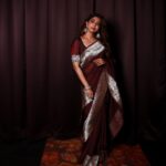 Poornima Indrajith Instagram - Padmavati ki saree ♥️ Got my hands on this gorgeous 40 year old vintage handwoven Benaresi silver border in the rarest hue of cinnamon-brown. Padmavati ki saree is an upcycled version of the original border to an organza base saree styled with zari embroiderey detail on the sleeve. Wardrobe : @pranaahbypoornimaindrajith Jewellery: @pureallure.in Hair : @sajithandsujith Photography: @vishnu__photography___ Team Maxxo: @dayonphotos @rizwanmechoth (@maxxocreative #sustainablefashion #upcycle #conciousfashion #generationrestoration #repeatoutfit ##madeinindia #faahionrevolution #heritagefabrics #benarasisaree #benarasiweaves #pranaahbypoornimaindrajith #benaresisbypranaah #handmade