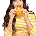 Rashmika Mandanna Instagram - Any guesses why I am inside a Piri Piri hourglass... eating a burger in slow motion? 🙊 Some things you #DontExplainJustEnjoy 🤍 Just like the uniquely spicy Piri Piri McSpicy Chicken Burger…😋 For Limited time only…. Get yours now🥰 Available at a @mcdonalds_india near you and on McDelivery 🤍 #PiriPiriMcSpicy #ImLovinIt #McDonalds #Partnership