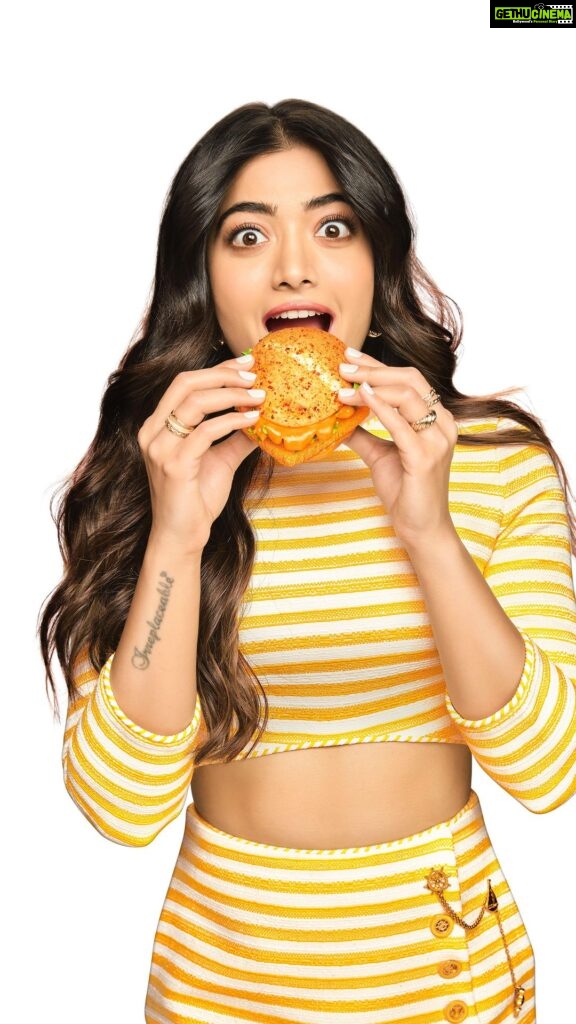 Rashmika Mandanna Instagram - Any guesses why I am inside a Piri Piri hourglass... eating a burger in slow motion? 🙊 Some things you #DontExplainJustEnjoy 🤍 Just like the uniquely spicy Piri Piri McSpicy Chicken Burger…😋 For Limited time only…. Get yours now🥰 Available at a @mcdonalds_india near you and on McDelivery 🤍 #PiriPiriMcSpicy #ImLovinIt #McDonalds #Partnership