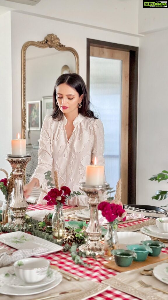 Roshni Chopra Instagram - 🍽️ If food is your love language the the tablescape is the perfect backdrop to set the mood ❤️! Playing with @elvylifestyle ‘s most gorgeous collection of tableware and decor accents to set up a festive feast 🎄❤️ top 3 tips - 1 .Let the crockery be the hero & take color and mood inspiration from it for the rest of your decor 2. Mix and match luxe with rustic , minimal with ornate color with monotone - contrast is what draws the eye 3. Play with different heights and proportions in your setting to give that layered effect which makes the tablescape as delish as the food ! #rohome #christmastable #tablesetting #interiorstyling #crockery #decor #gift @pr.richagupta