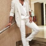 Santhosh Prathap Instagram - W H I T E 💛 V I S I O N Styled actor @santhoshprathapoffl for a wedding event he emceed this week. Looking stylish in all white ensemble. Vibing it in off white thread embroidery semi casual blazer paired with soft satin low neck inner top and white pants. White blazer @kinslager_tailor_made Styling #styledbyyogash