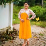 Sarayu Mohan Instagram - Bright day! Aliya cut frock,yoke printed hakkoba,bottom mustard yellow shade, lining attached,sizes,m to xxl Clicks @__vivid_snaps ♥️ Chottanikkara, India