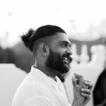Sid Sriram Instagram - “Do the Dance” Music Video Out Now / Link in Bio When writing “Do the Dance”, it was intuitively clear to me that the spirit of the piece was one’s search for home. No, not search, longing. The deep longing to find and exist in spaces that feel like honest, open, clear, warm, liberating breaths of fresh air; home. It was a fulfilling experience working on the video for “Do the Dance”. We shot it at the Malibu Hindu Temple and worked with UCLA’s Raas Bataaka dance team. Both of these elements feel like deep snapshots of my experience growing up Indian in California.  Growing up, I would frequently visit and perform at temples just like this one with my family. In high school, my Gujarati friends would bring me to Dandiya Raas events every year, and I vividly remember those nights being filled with the same excitement and joy we’d feel when going to school dances.  The Malibu temple has such a powerfully calming energy, grateful to have shot there. And big shout out to the girls from UCLA Raas for bringing a palpable joy to the shoot. The final element that felt necessary was someone to embody this combination of search/longing/joy. I’m deeply grateful to Tanima for welcoming my request for her to be in the video. Her presence in it is effortless, subtle and powerful.  The Indian Diasporic experience in America is specific, layered and full of dimension. Tanima approached the creation of this visual with a true sensitivity, care and respect. It feels like home.  Shouts to everyone involved:  Director - Tanima Mehrotra @bytanima DP - Cam Roberts @cont4ct Production - Muddy Water @muddywater / Studio Puja @studiopuja EP: Farah Idrees @idr_farah EP: McCray Sutherlin @mccray Producer: Nour Sayeh @noursayeh Associate Producer: Sahnah Dhrif @sahnahhh Editor - Michael Rees @leadprotagonist Colourist - Connor Bailey @connorjbailey Stylist- Quinci Bryant @quinci  Clothing- @vihanga.co Location- Malibu Hindu Temple @MalibuHinduTemple Dancers - UCLA Raas Bataaka @bataakanushaak Label - @defjam (Got more ppl to shout out but my captions be too long for IG, gonna shout them out in the comments) All love