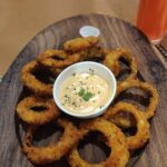 Siddhi Mahajankatti Instagram - • Thank you @butterartisancafe for having me over❤️ The food was finger licking yummm ❤️ All the very best @surumi_nb and really proud of your husband for supporting your goals! Head over to @butterartisancafe and have these : - Pink lemonade - Onion rings (This is my personal favorite) - Pineapple feta cheese salad ( This was finger licking yum) - Mushroom stroganoff (This filled my tummy )• PS : Swipe to see the food pictures 😋 Butter Artisan Cafe