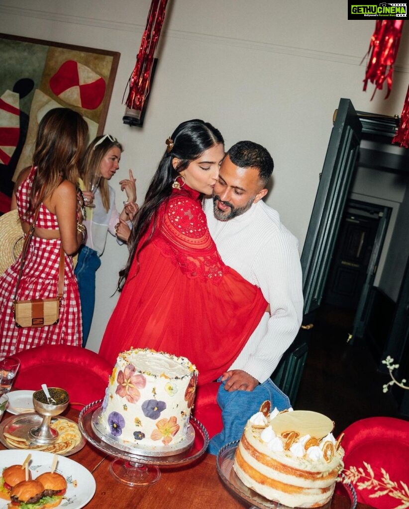Sonam Kapoor Instagram - My two beautiful boys, friends, cake, champagne, oysters, caviar and the perfect summer day! What more can a girl in red dress ask for her birthday. Thank you to everyone who wished me and to the universe for giving so bountifully. #everydayphenomenal #vayusparents #9thjune #gemini #birthdaygirl Notting Hill, London