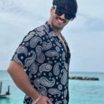 Thakur Anoop Singh Instagram - Immersed myself in the boundless embrace of the ocean's serenity where time stops and soul talks. #Thakuranoopsingh Outfit by @talwinder_singhofficial Courtesy @osmoholidays @transmaldivian @fushifaru #Maldivestourism #serene #beach #peace #soul #island #fushifaru #maldives #gateaway Fushifaru Maldives
