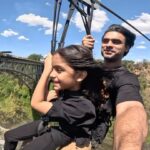 Tovino Thomas Instagram - Izza : My partner in adventure, my first born, my unconditional love, my lifeline. When Izza was born I had decided I would be the one to hold her first, always wanted her to have many of her “firsts” with me. And here we are making another first , beating the fear with smiles on our faces and the wind in our hair. Cannot wait to jump into more adventures with you, my precious one.🧿 #myfirstborn #myadventurepartner #herfirstadventure #likedadlikedaughter #zambiatozimbabwezipline #victoriafalls #zambeziriver #zimbabwe #zambia #africa Victoria Falls - Zambezi River