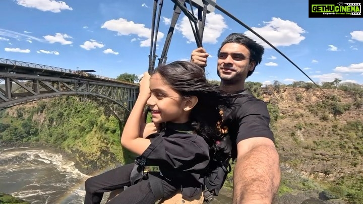 Tovino Thomas Instagram - Izza : My partner in adventure, my first born, my unconditional love, my lifeline. When Izza was born I had decided I would be the one to hold her first, always wanted her to have many of her “firsts” with me. And here we are making another first , beating the fear with smiles on our faces and the wind in our hair. Cannot wait to jump into more adventures with you, my precious one.🧿 #myfirstborn #myadventurepartner #herfirstadventure #likedadlikedaughter #zambiatozimbabwezipline #victoriafalls #zambeziriver #zimbabwe #zambia #africa Victoria Falls - Zambezi River