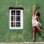 Amala Paul Instagram - Flowers of joy bloom in her hands as she jumps towards a world painted in green and filled with endless adventures. 🌿🌸 Captured by @chathan__ #lightscameraaction #travelgram #wanderlust #exploremore #mountainlife #instanature #travelphotography #hikingadventures #exploretheworld #mountainlover #forestvibes