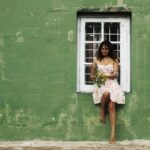 Amala Paul Instagram - Flowers of joy bloom in her hands as she jumps towards a world painted in green and filled with endless adventures. 🌿🌸 Captured by @chathan__ #lightscameraaction #travelgram #wanderlust #exploremore #mountainlife #instanature #travelphotography #hikingadventures #exploretheworld #mountainlover #forestvibes