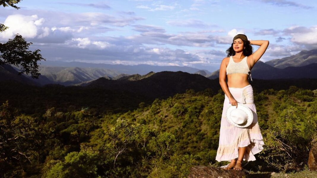 Amala Paul Instagram - ✨🎭 Embracing the Spotlight Again 🌟 Captured by @chathan__ #lightscameraaction #newmoon #travelgram #wanderlust #exploremore #mountainlife #instanature #travelphotography #hikingadventures #exploretheworld #mountainlover #forestvibes