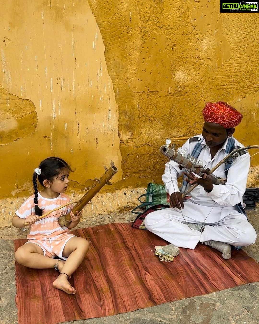 Ankita Bhargava Patel Instagram - Noticed how I was away from Insta for a few weeksโฆ ๐
โโ๏ธ I was busy making the most of Mehrโs summer vacations !๐ We visited 3 states in India this summer! And believe you me, Every single day was a beautiful experience that enriched our souls! Will share my experiences with u all soon ! P.S In this picture Mehr is seen playing an ancient instrument called RAVANAHATHA at the Amer Fort in Jaipur with an immensely talented musician who was kind enough of teach her how to play this mesmerising instrument. They played my favourite song together and i tried singing along too! ๐คฃ๐๐๐ #summer #vacation #rabbdimehr #momlife #motherhood #motherdaughter #travel #travelgram #jaipur #rajasthan #kidswhotravel #indiafirst